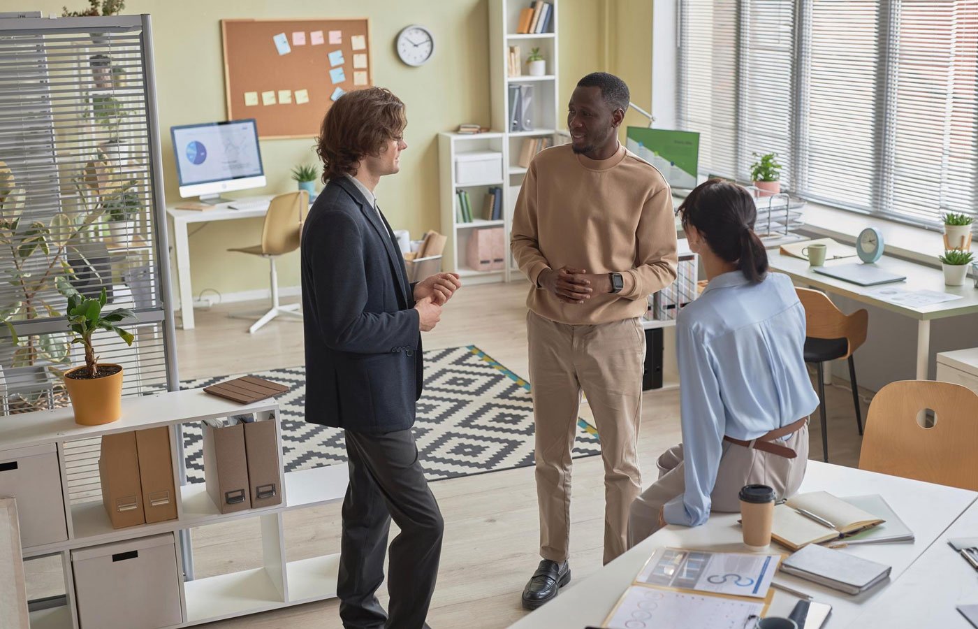 Diverse team discussing a project, representing a mystery employee integrated into a business for WEconsults' mystery shopper consultancy UK service